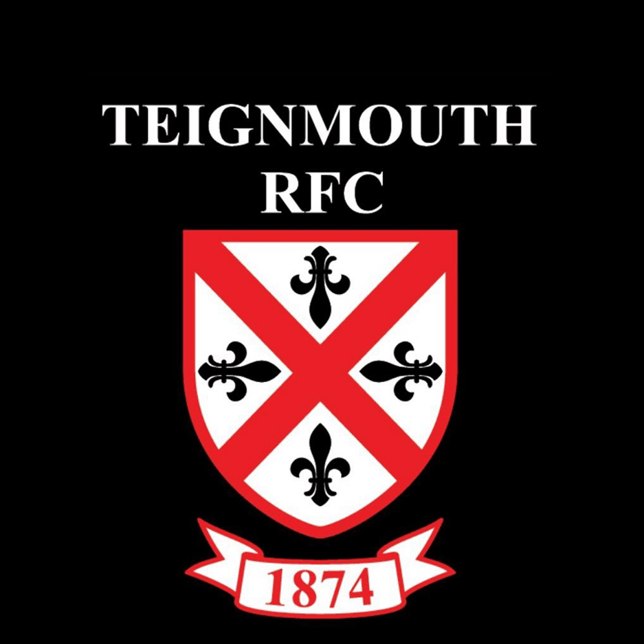 The image shows a black background with white text reading 'TEIGNMOUTH RFC,' a crest with a red X and black fleur-de-lis symbols, and a white banner at the bottom with the year '1874.'
