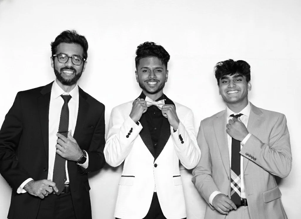 Group of guys taking photo in EXP PHOTO glam Photo Booth in Detroit