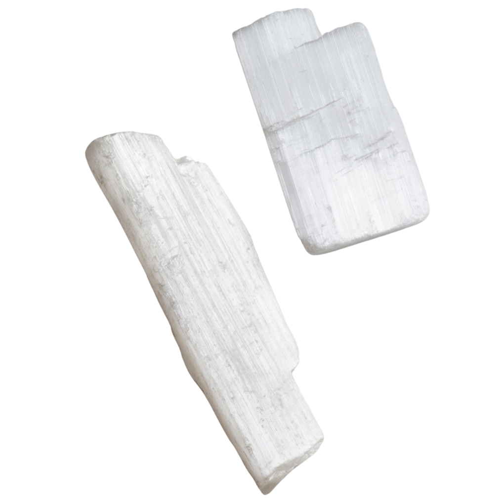 Two white selenite sticks, one larger and one smaller, used for writing on blackboards.