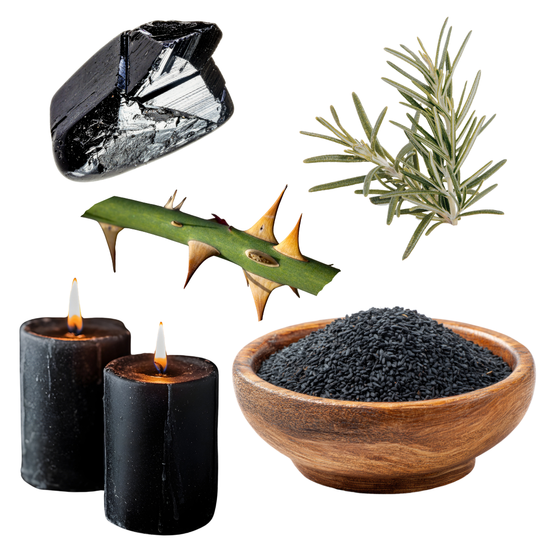 A collection of black obsidian, a sprig of rosemary, a rose stem with thorns, a bowl of black salt, and two black candles with lit wicks.