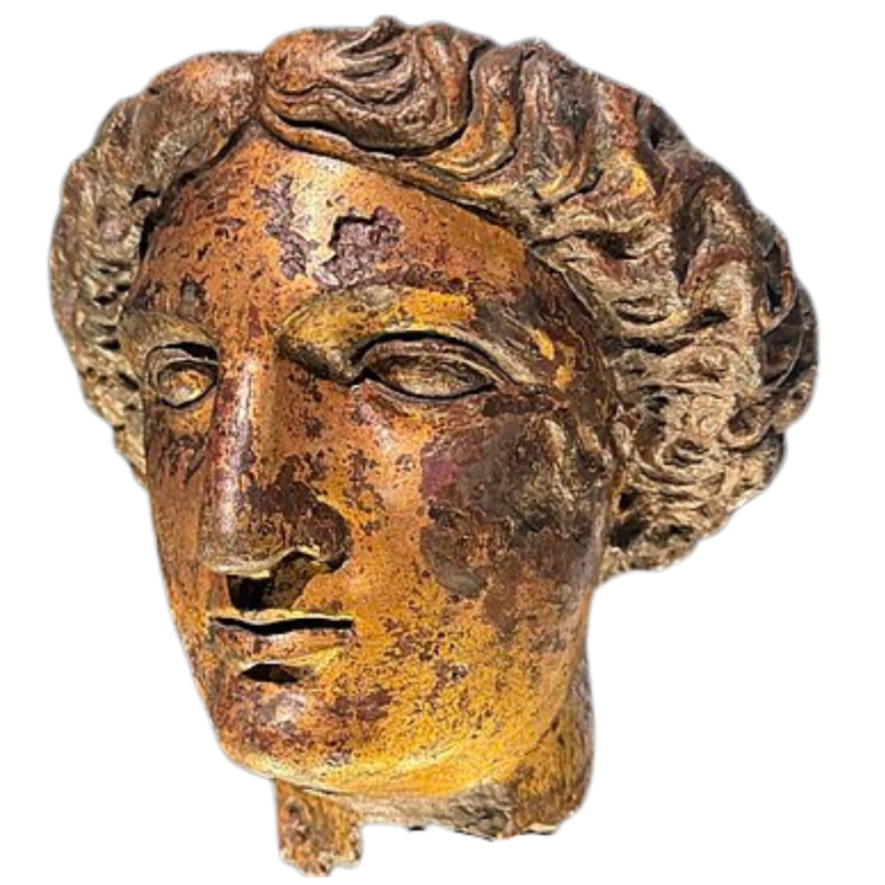 Ancient bronze or ceramic sculpture of a woman's face with detailed wavy hair.