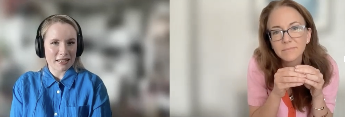 Two women are participating in a video call. The woman on the left has blonde hair, wears headphones and a blue shirt. The woman on the right has red hair, glasses, and is wearing a pink sweater.