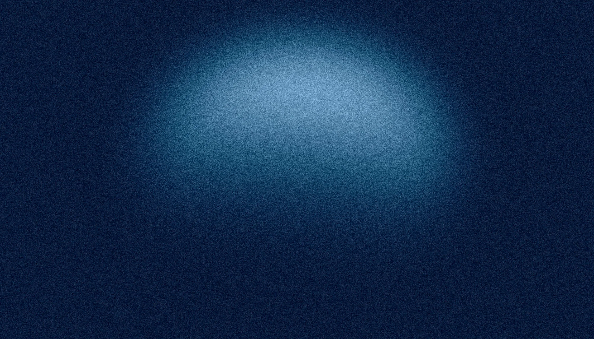 Blurred dark blue background with gradient light spot in the center.