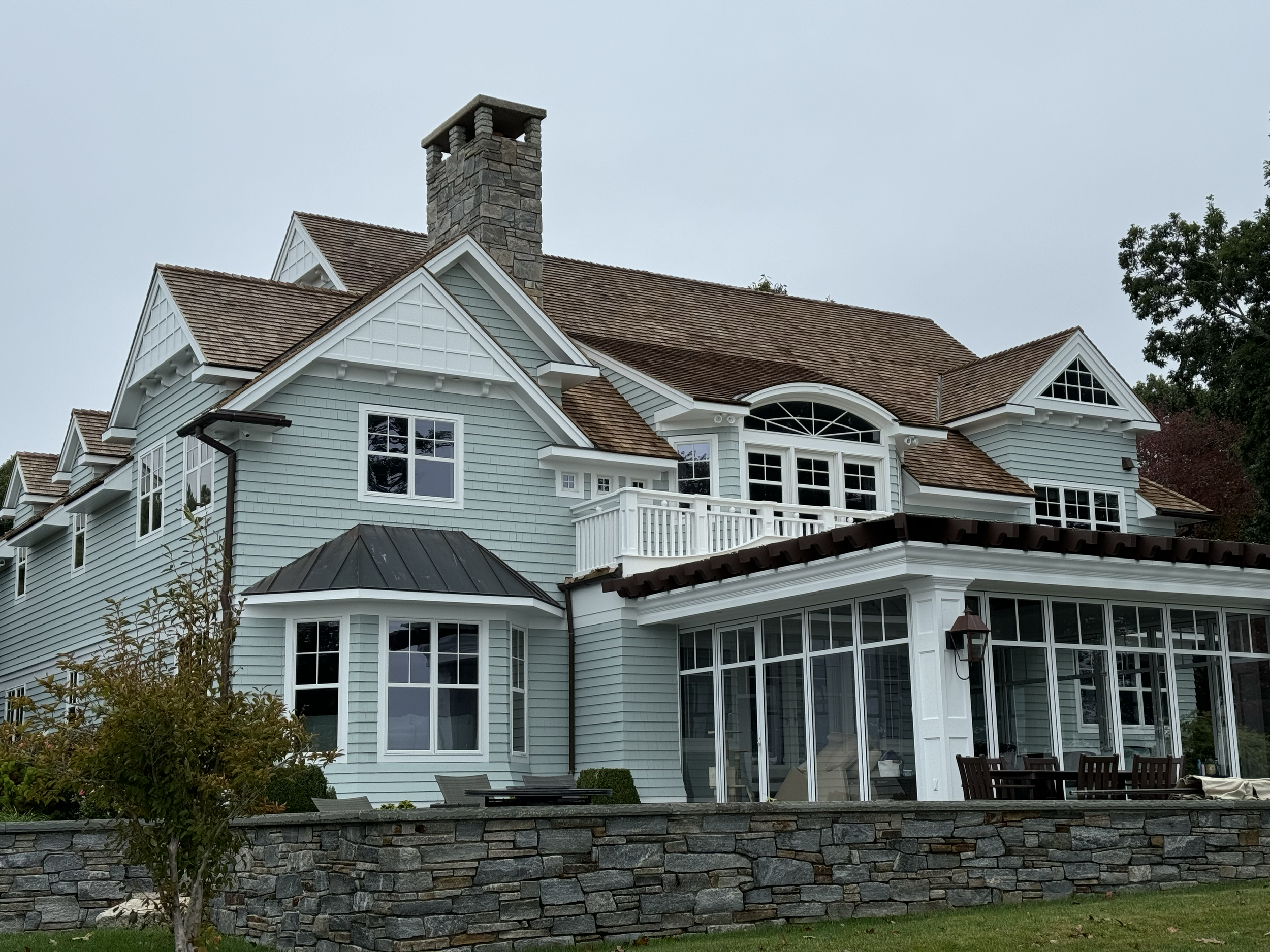 Completed restoration — rear of the home and outdoor living area.