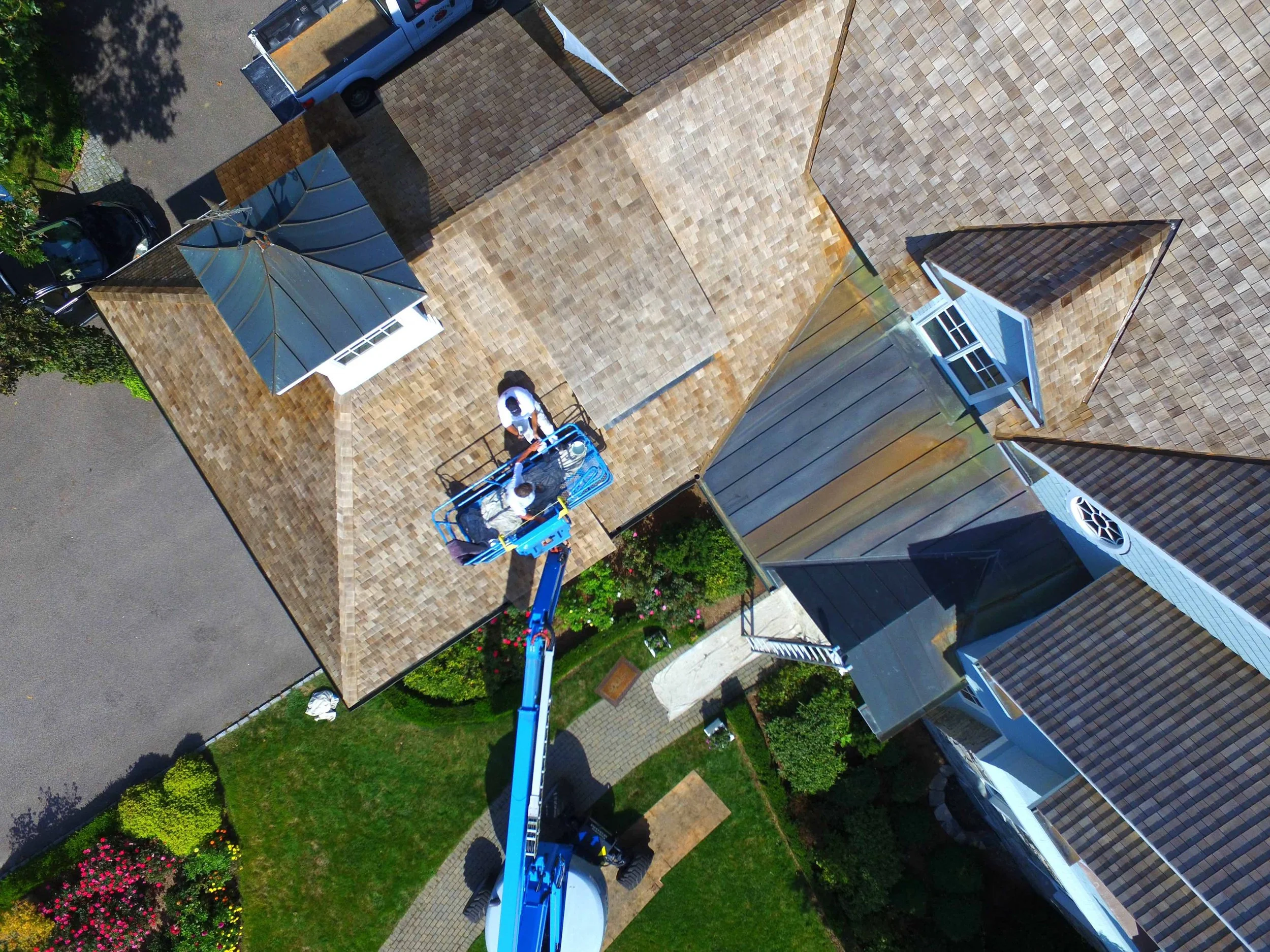 Cedar shake roof — detailed sealant work.