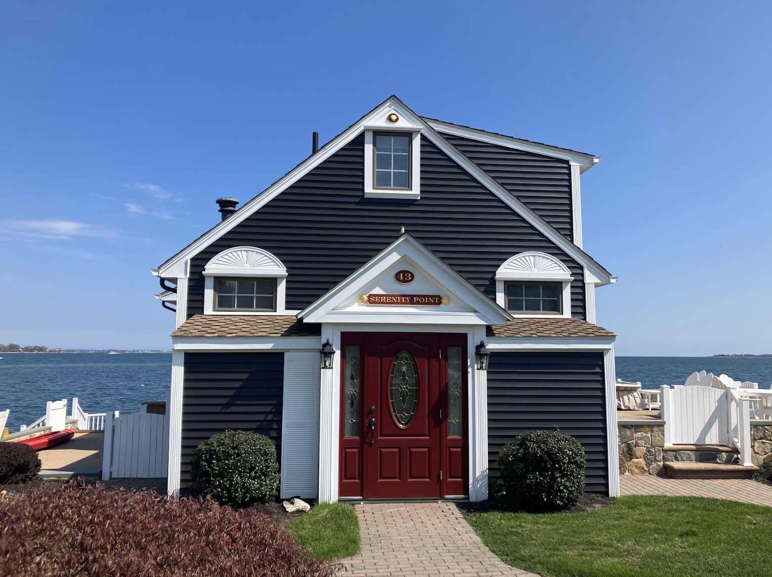 Exterior painting of waterfront home in Latimer Point, Stonington, Connecticut, by Cyr Painting and Restoration
