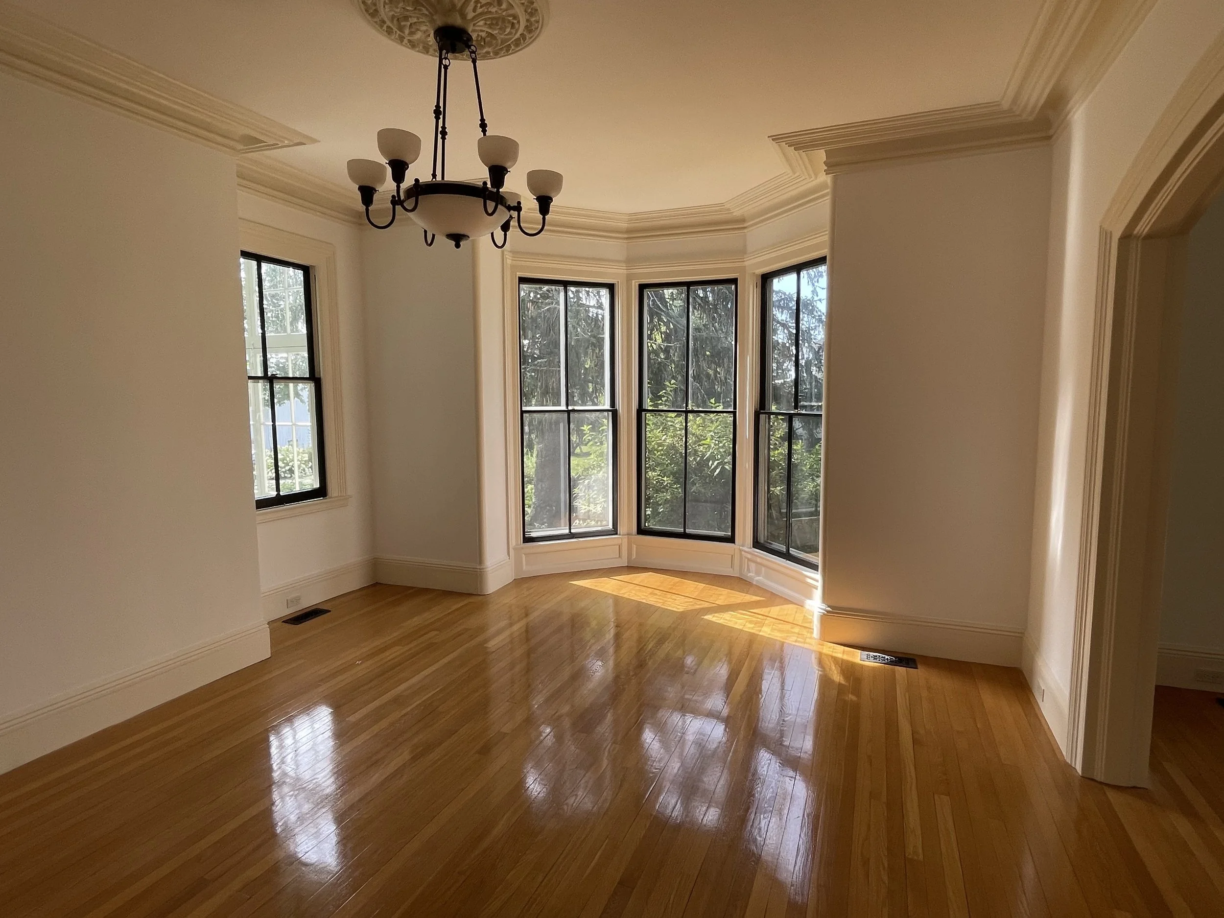 Refinished interior and hardwood floor in Mystic, Connecticut by Cyr Painting and Restoration
