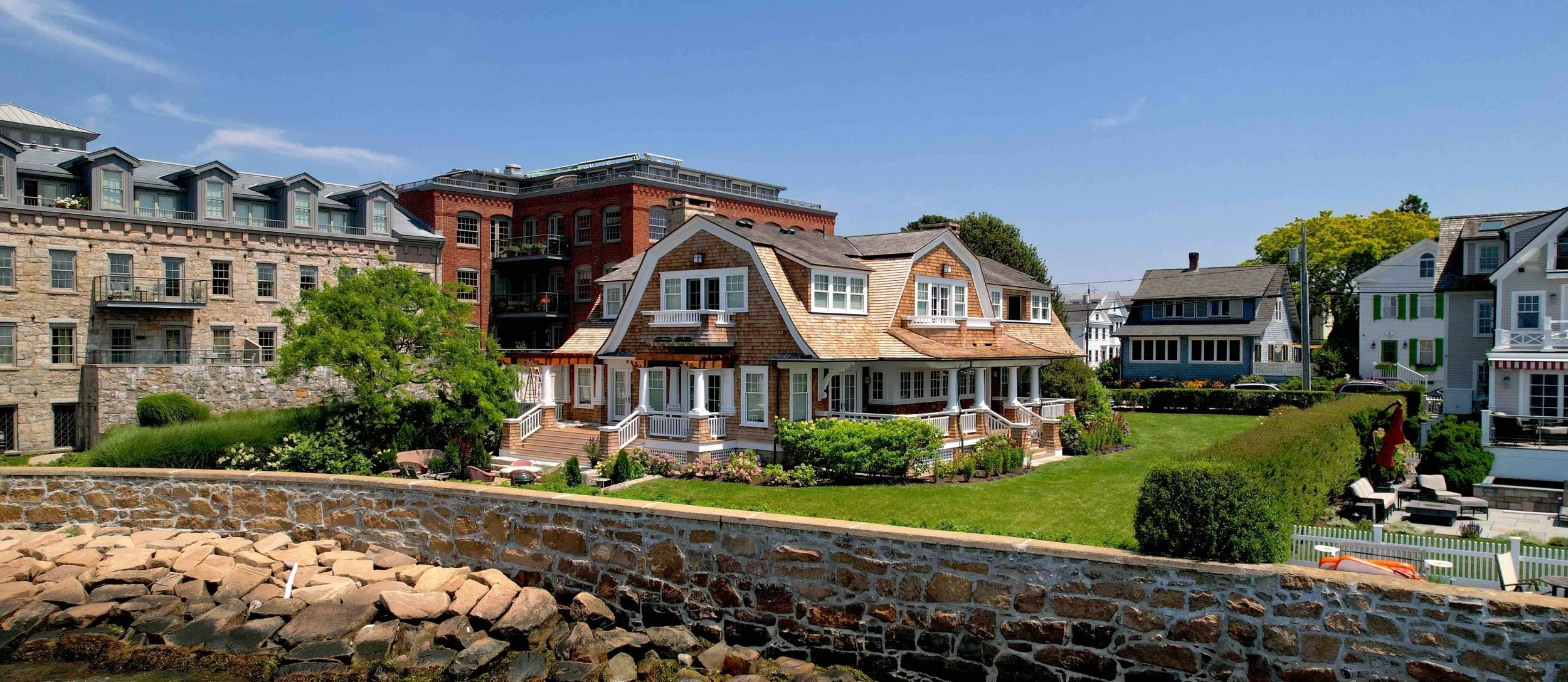 Cedar shingle waterfront home on the Connecticut and Rhode Island shoreline by Cyr Painting and Restoration