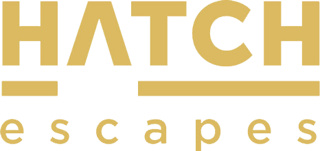 Logo of HATCH Escapes in black and gold lettering.
