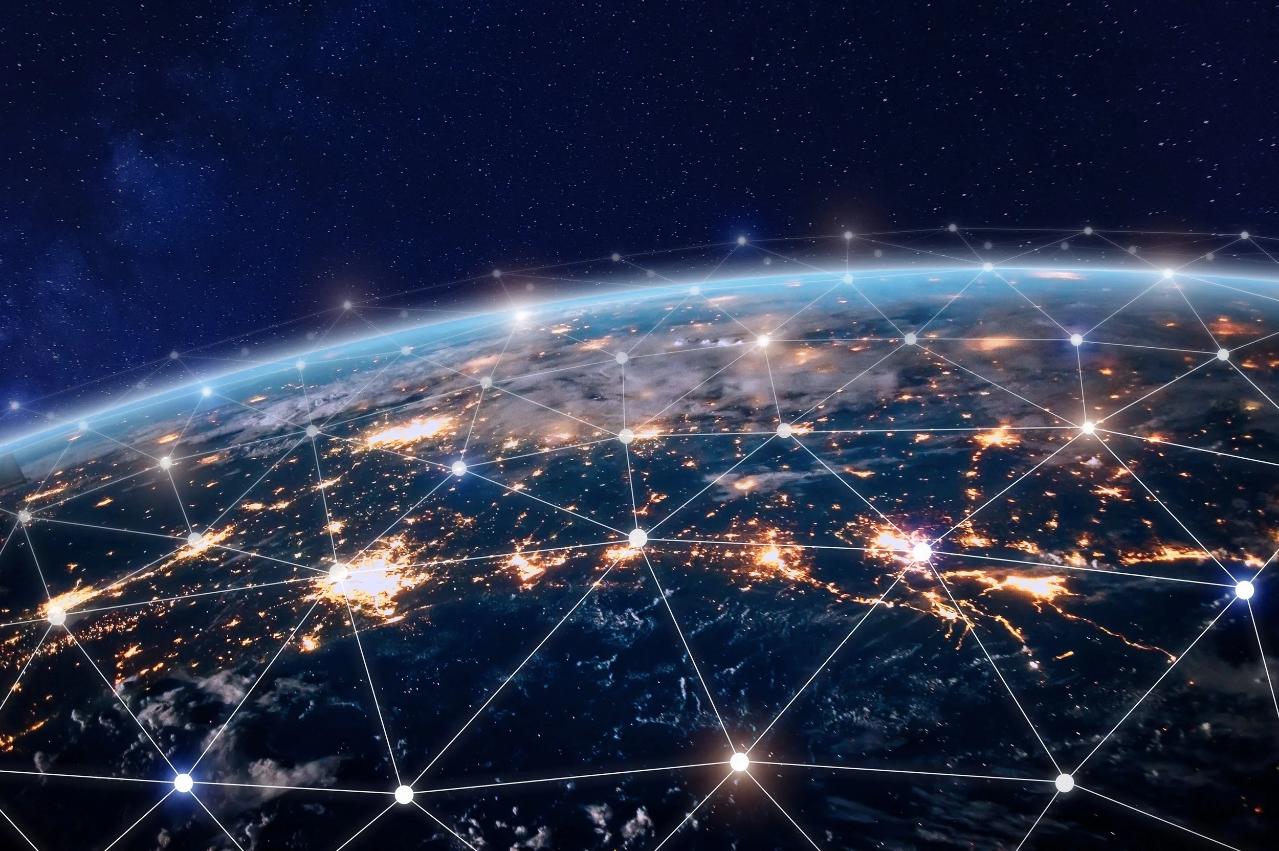Earth viewed from space with illuminated city lights, a glowing atmosphere, and a network of interconnected points overlayed on the surface.
