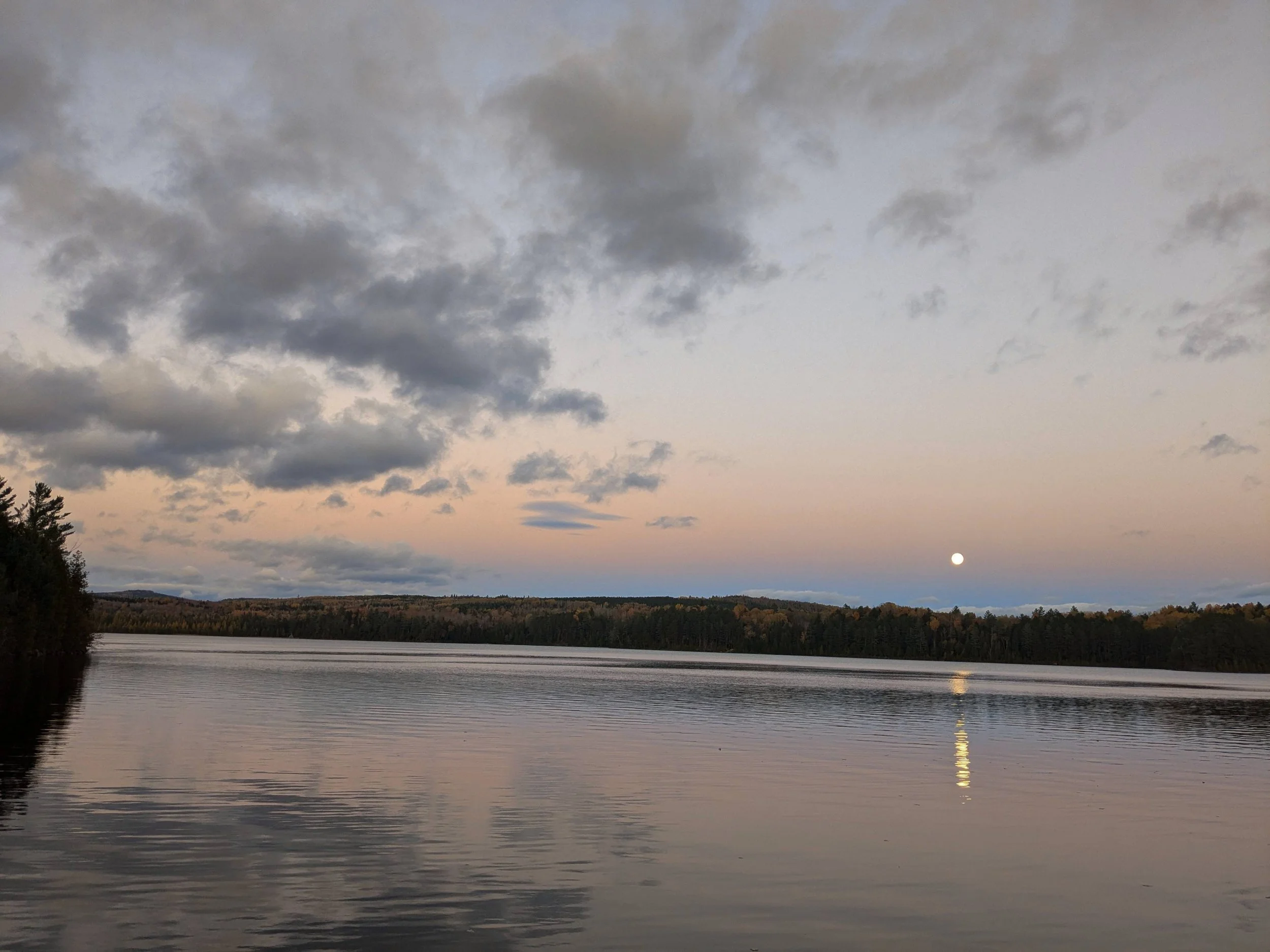 Phones cannot capture moonrise from the dock.