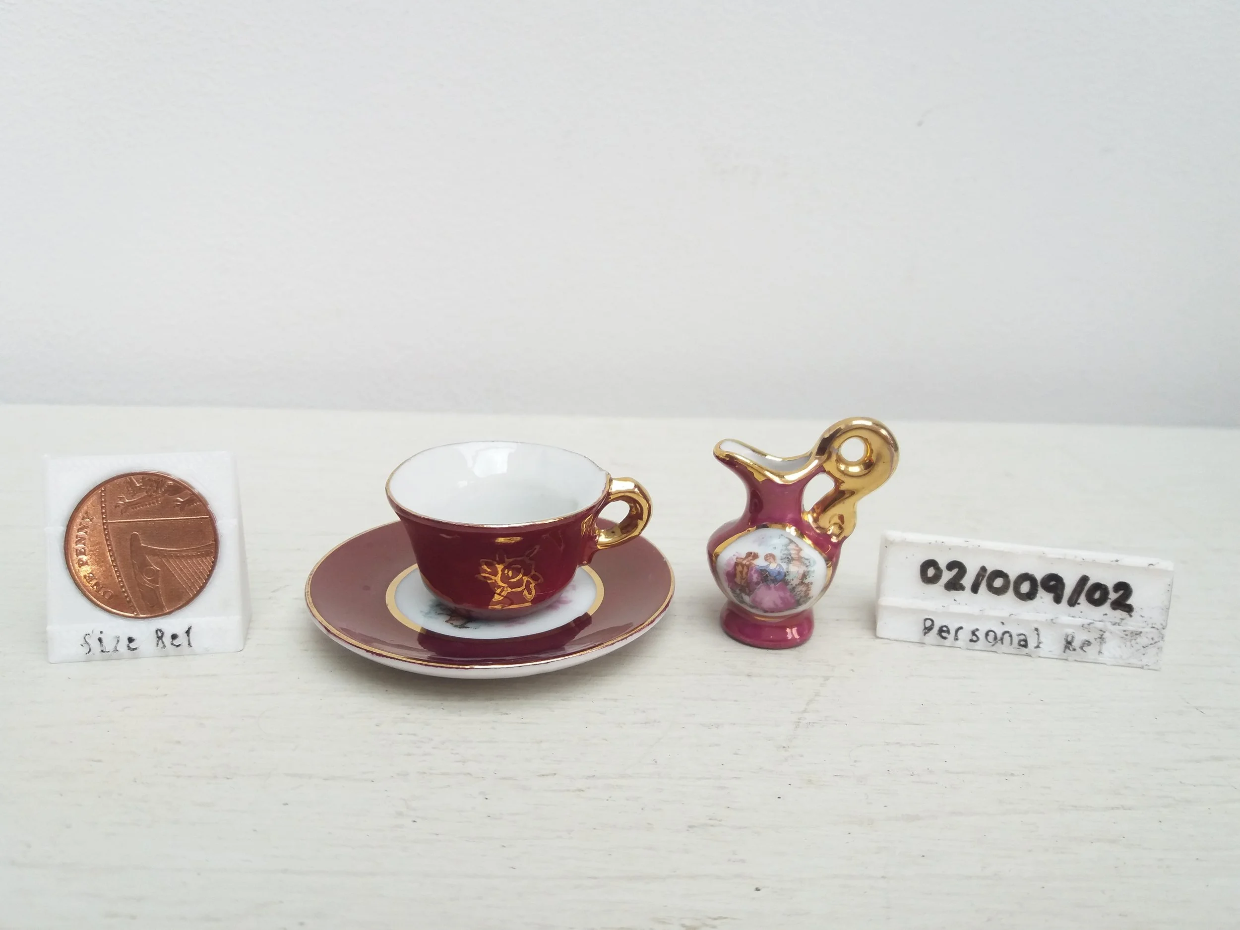 Limoges-Style Courting Couple Doll's Teacup, Saucer & Mug