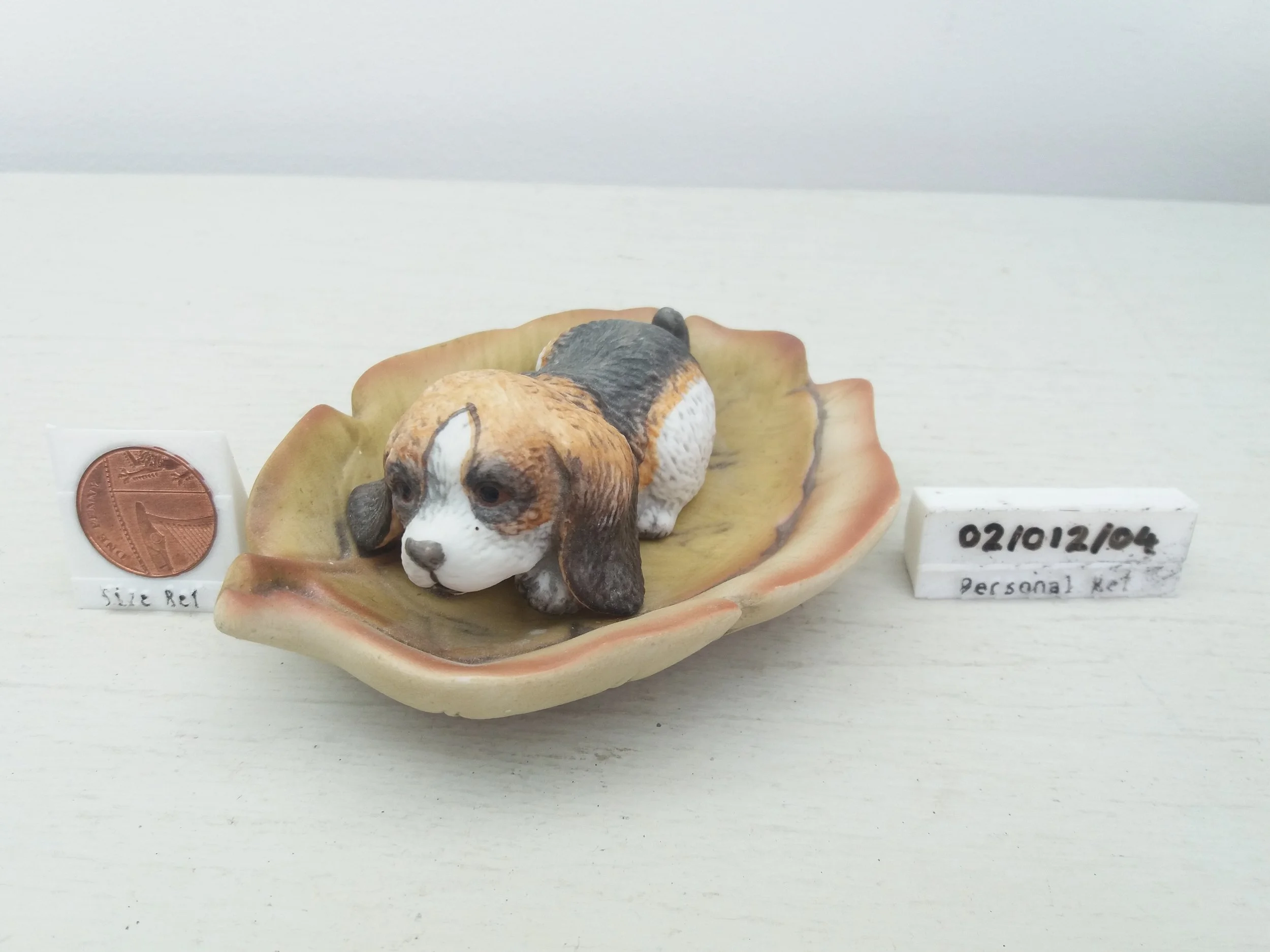 JR Akita Ceramic Spaniel Puppy on a Leaf