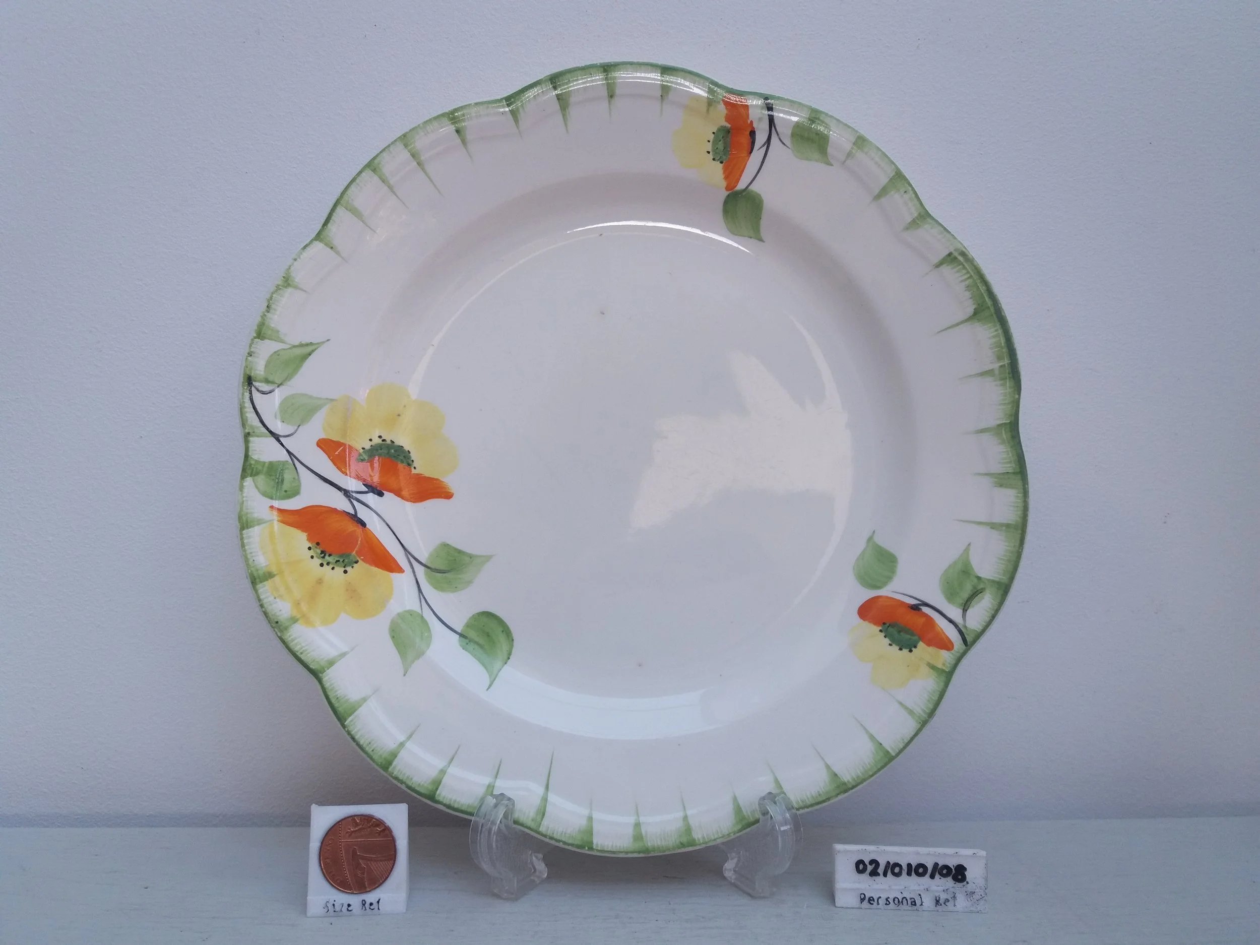 Floral Plate (Light Damage)