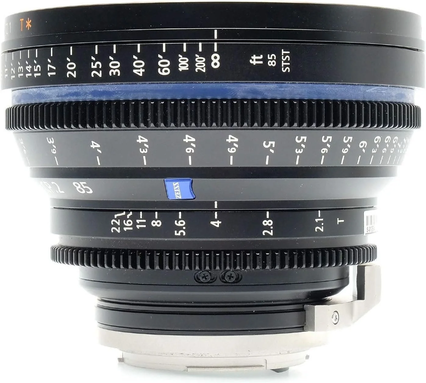 A camera lens with focus distance markings in feet and meters, and aperture settings visible on the aperture ring.