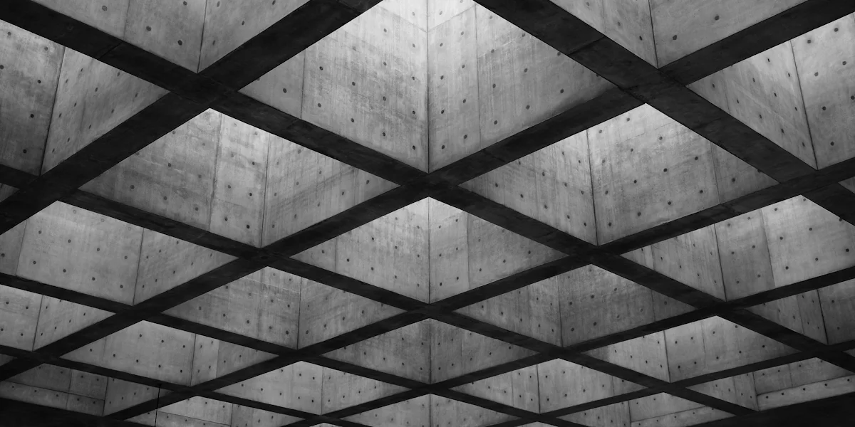 Concrete ceiling with intersecting beams and backlight — GrowthPains operational services