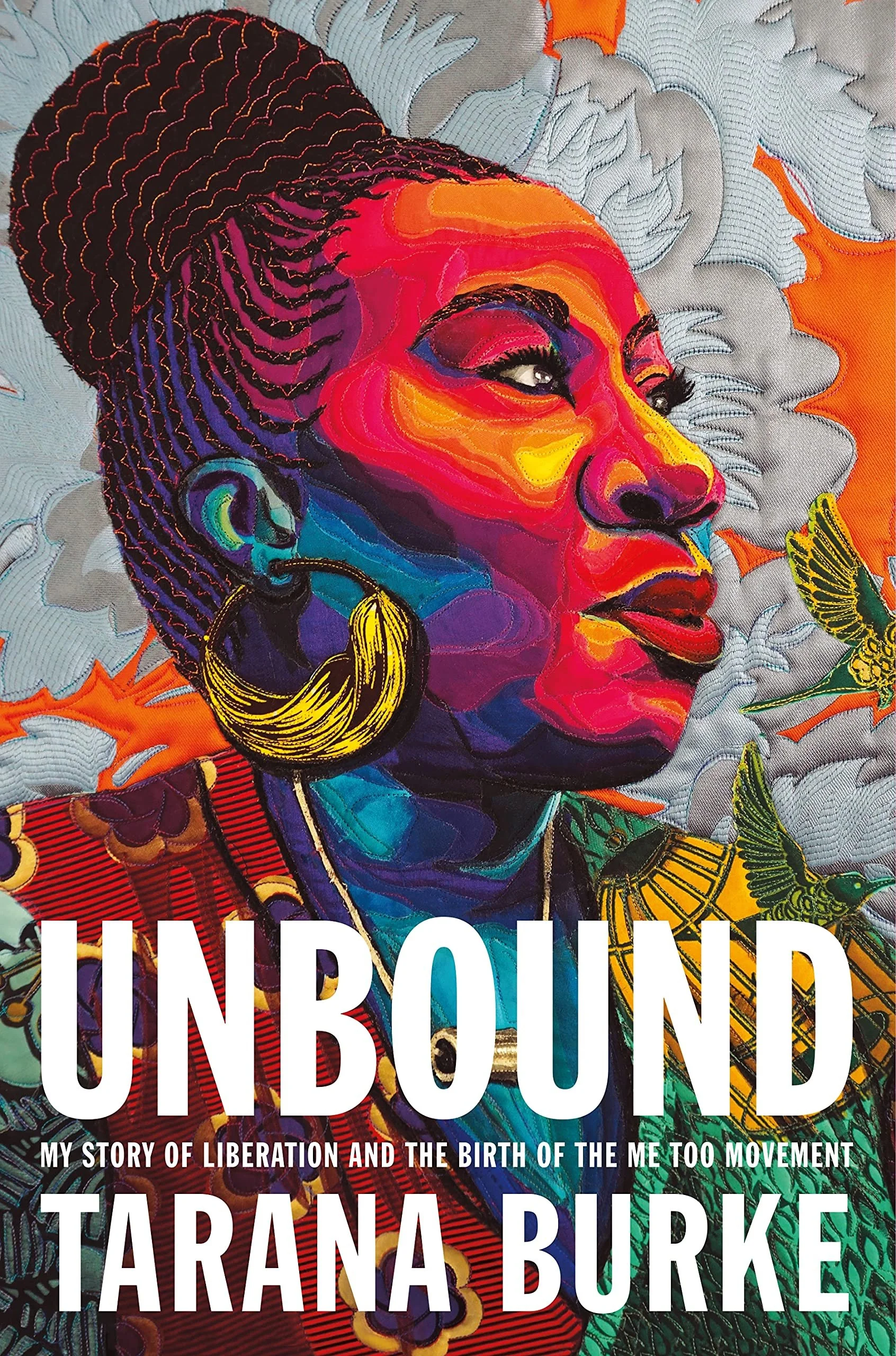 Colorful quilt with embroidered portrait of a woman with braided hair and large hoop earring, surrounded by leaves and birds with a bold text overlay.