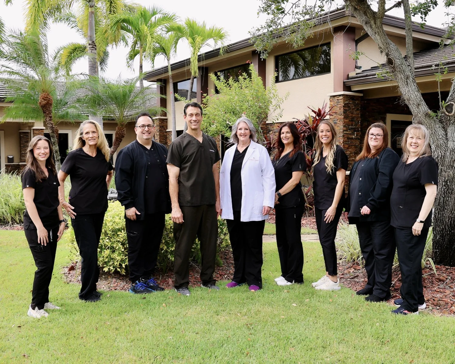 The Maris Dental Studio team outside the office in Fort Myers