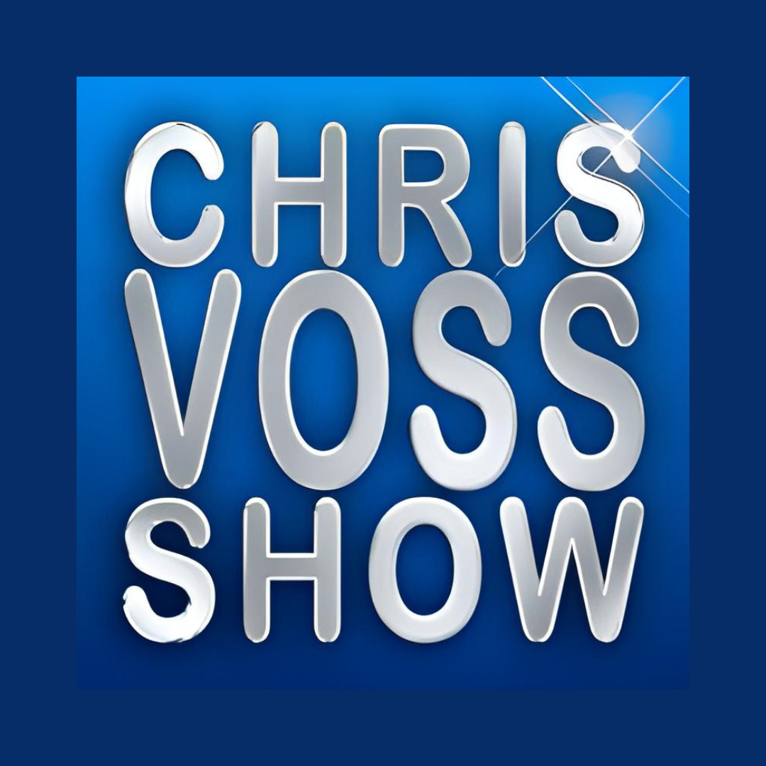 Illuminated neon sign reading 'Chris Voss Show' on a blue background.