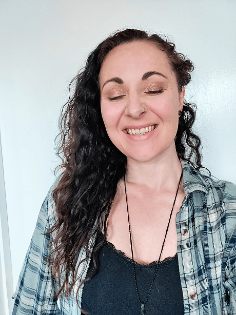 Hannah, the Squarespace web designer behind FenViolet, smiling — she left the 9-5 to help small business owners get a website they're proud of