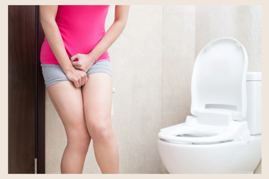 A woman standing by a toilet, holding her vulva and vagina. She is nervous about a leaking bladder and holding her vulva to stop leaking. Bladder incontinence. Urinary incontinence. bladder leaking