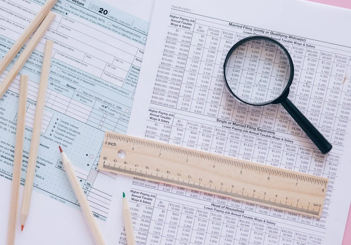 Magnifying glass representing audit defense and resolution