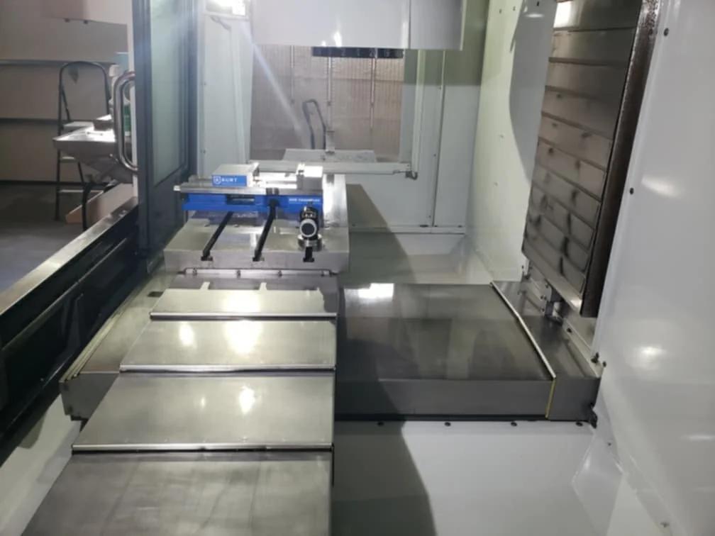 A close-up view of a CNC machine or milling machine used for precision manufacturing or machining.