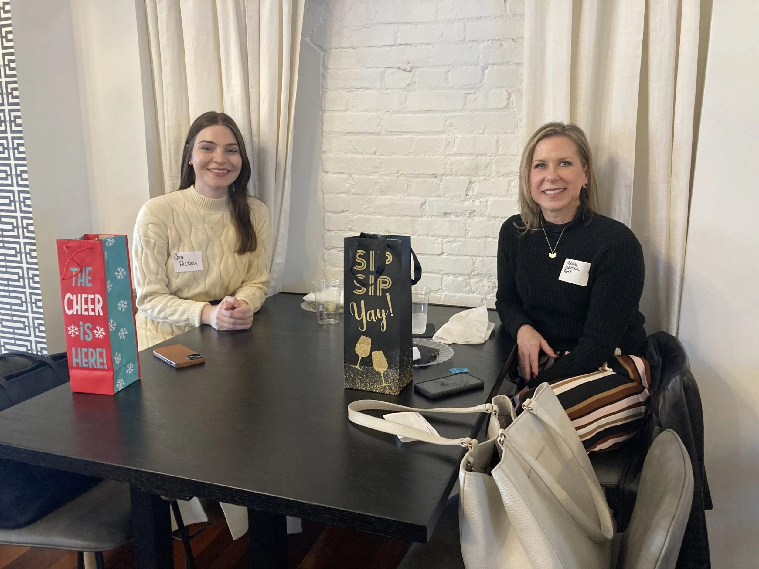 2 women with giftbags