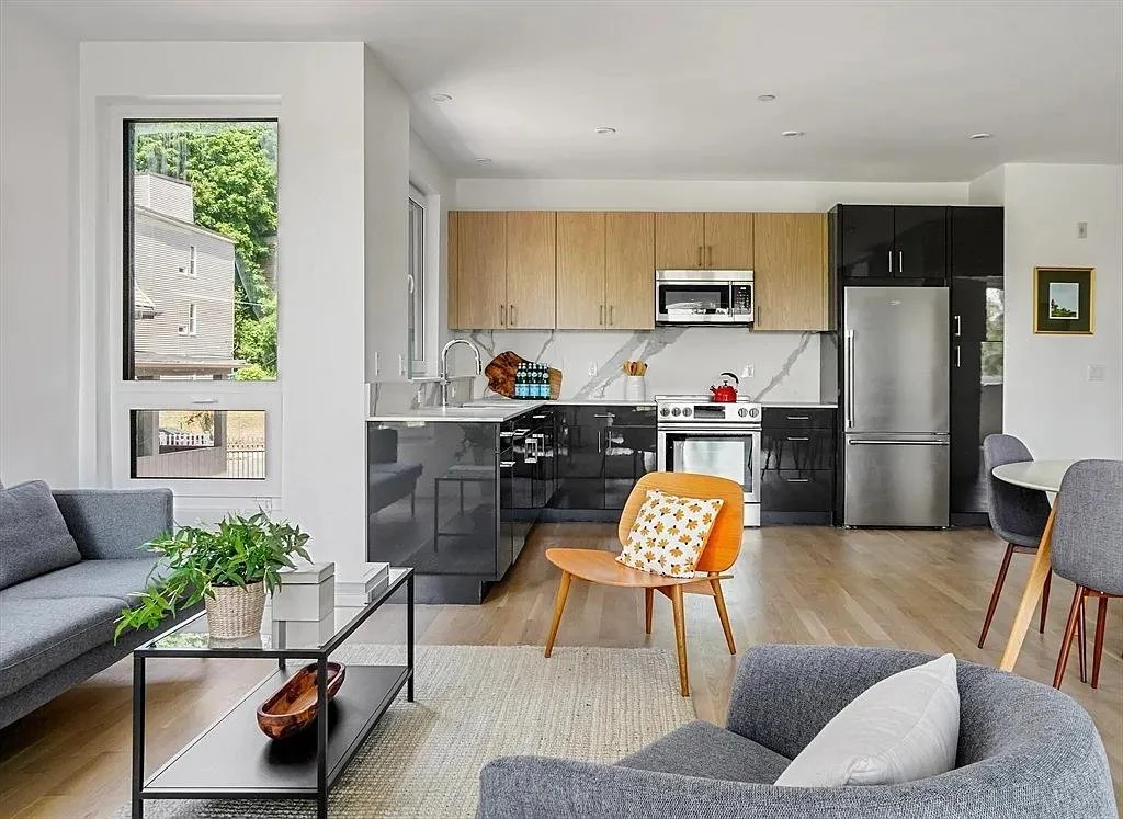 Apartment building renovation in Roxbury, Boston, featuring modern kitchens, open living spaces, and durable finishes. Upper Construction delivers high-quality remodeling across Boston communities.