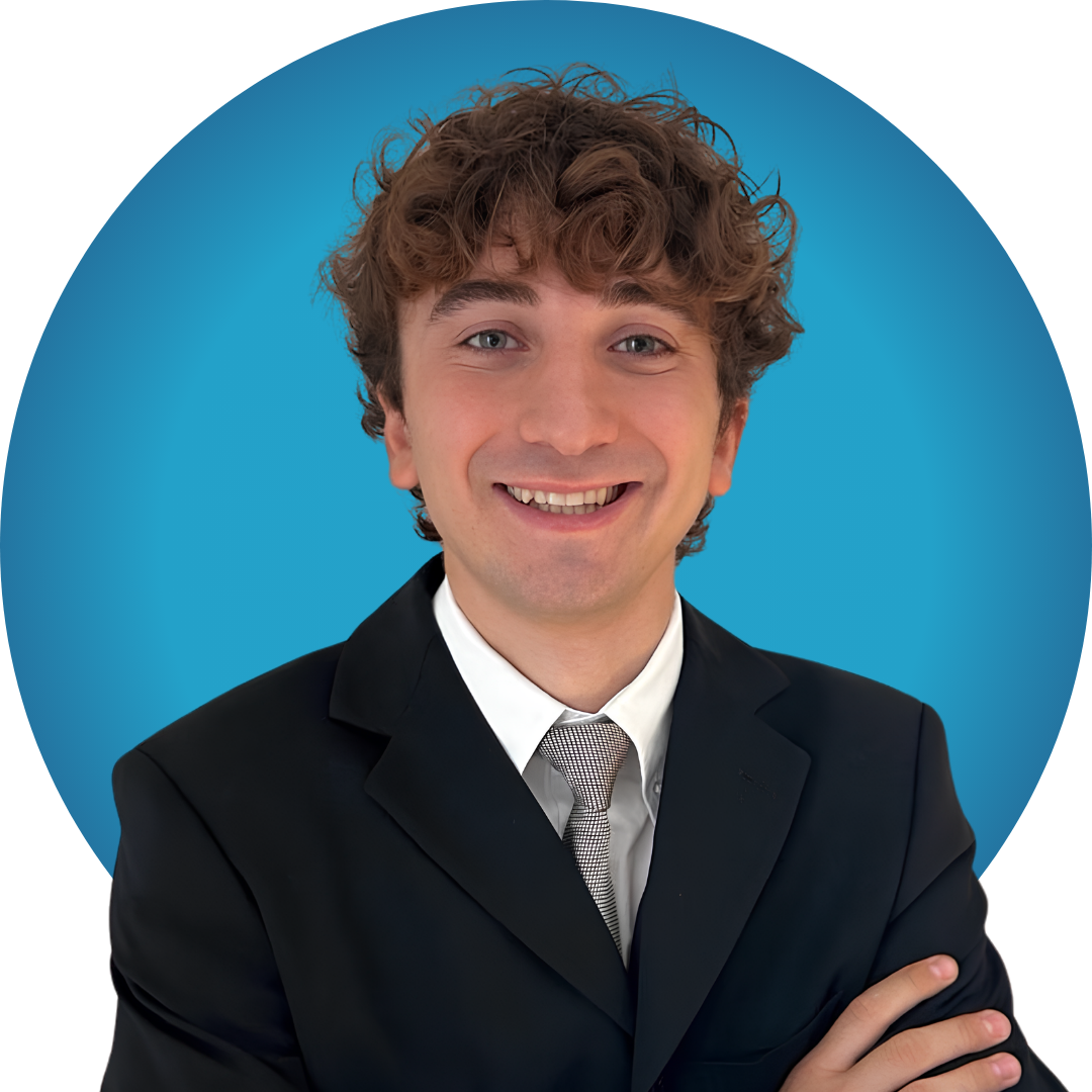 A young man with dark hair in a suit