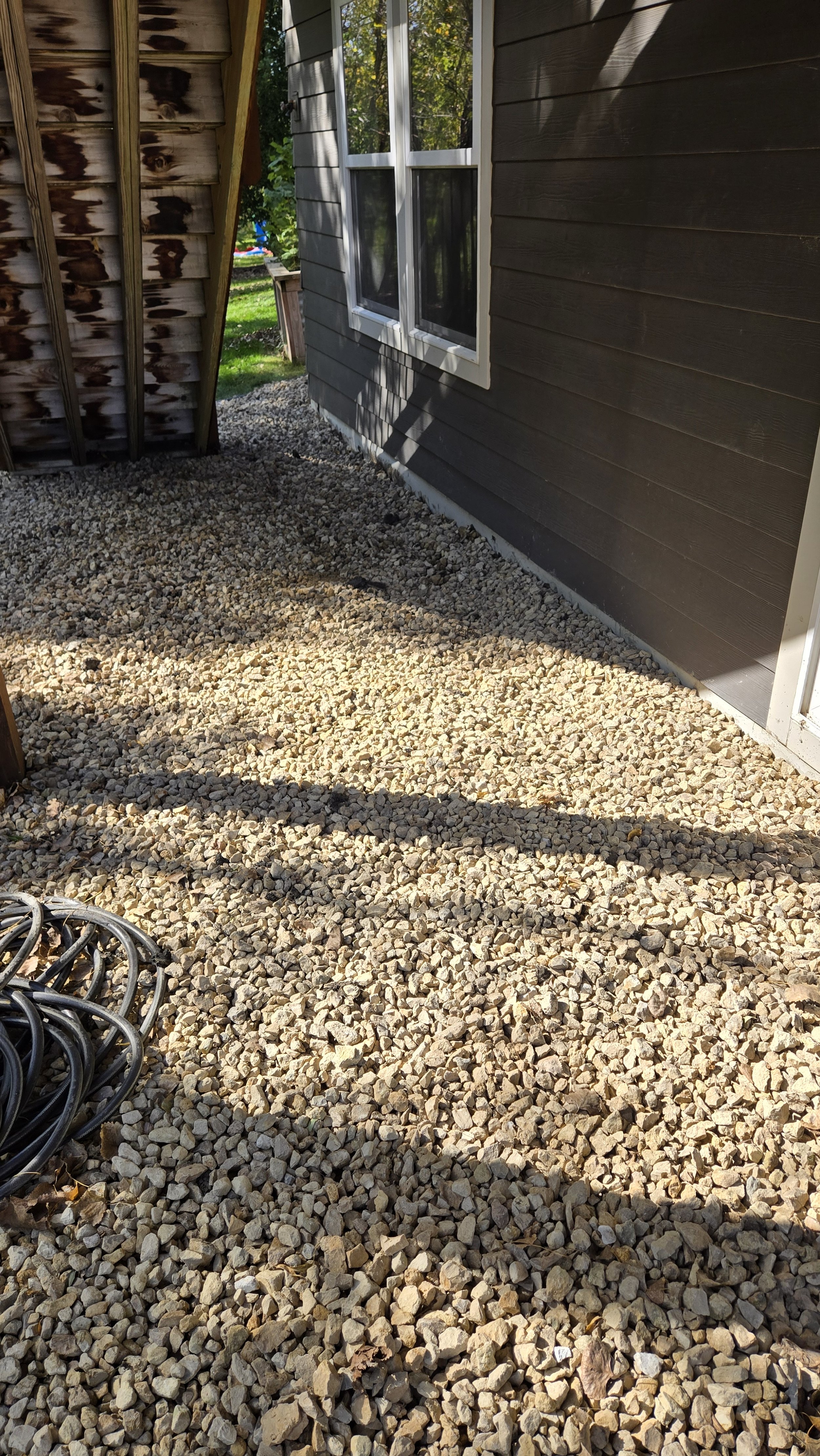 Installed Drain Tile, Corrected Lifting Ground Break Fabric, And Removed and Replaced Rotten Stair Stringer