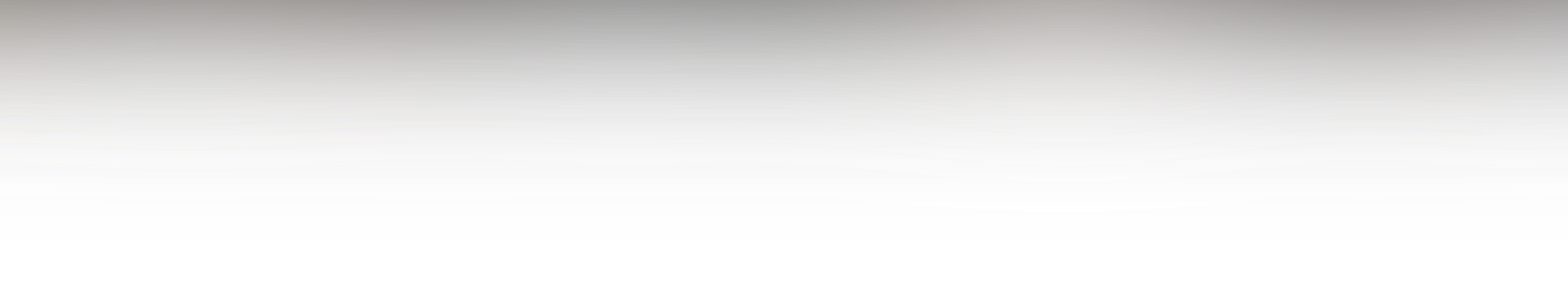 A long metallic hose reel mounted on a white wall with orange piping above it.