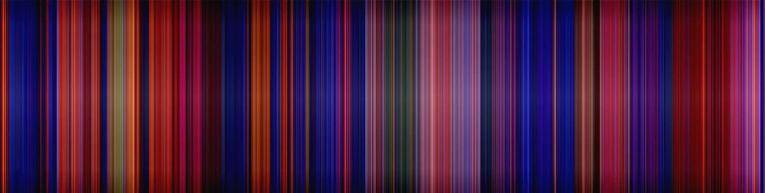 An abstract digital art image with vertical multicolored streaks of various shades of blue, red, orange, green, black, and purple.