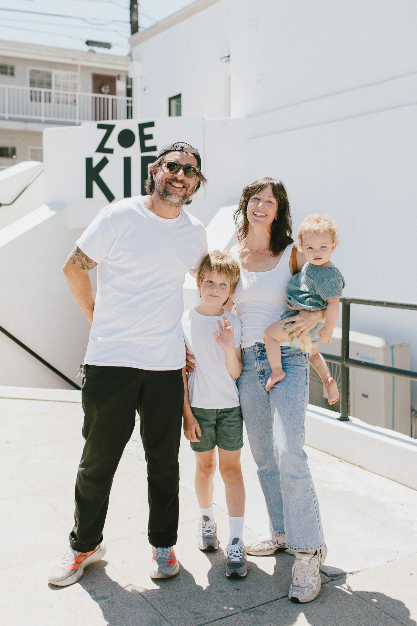 A family outside ZOE Kids