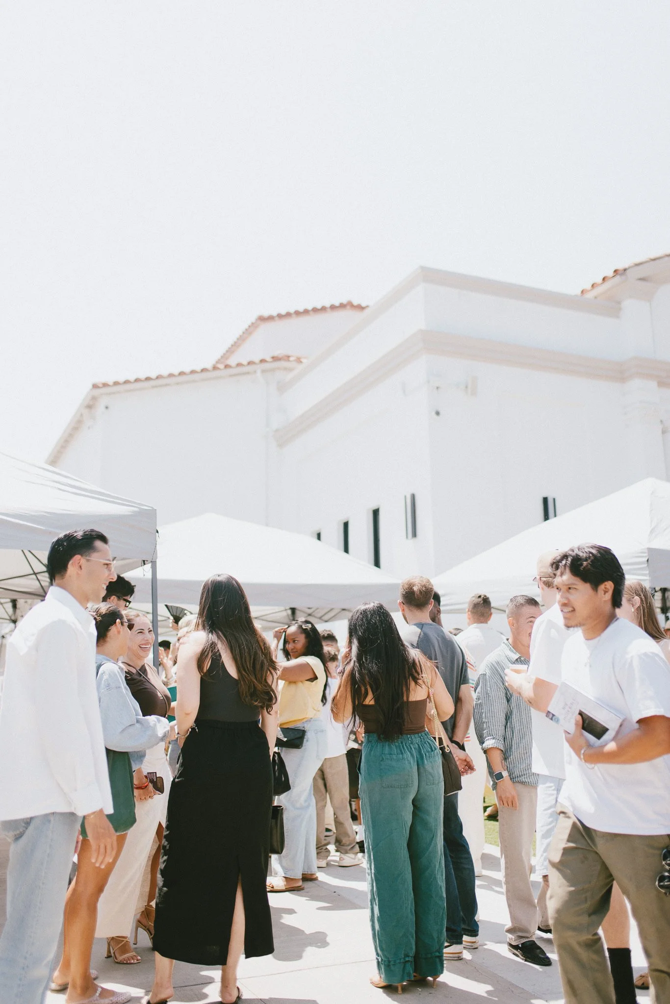 People gathering outside ZOE Highland Park