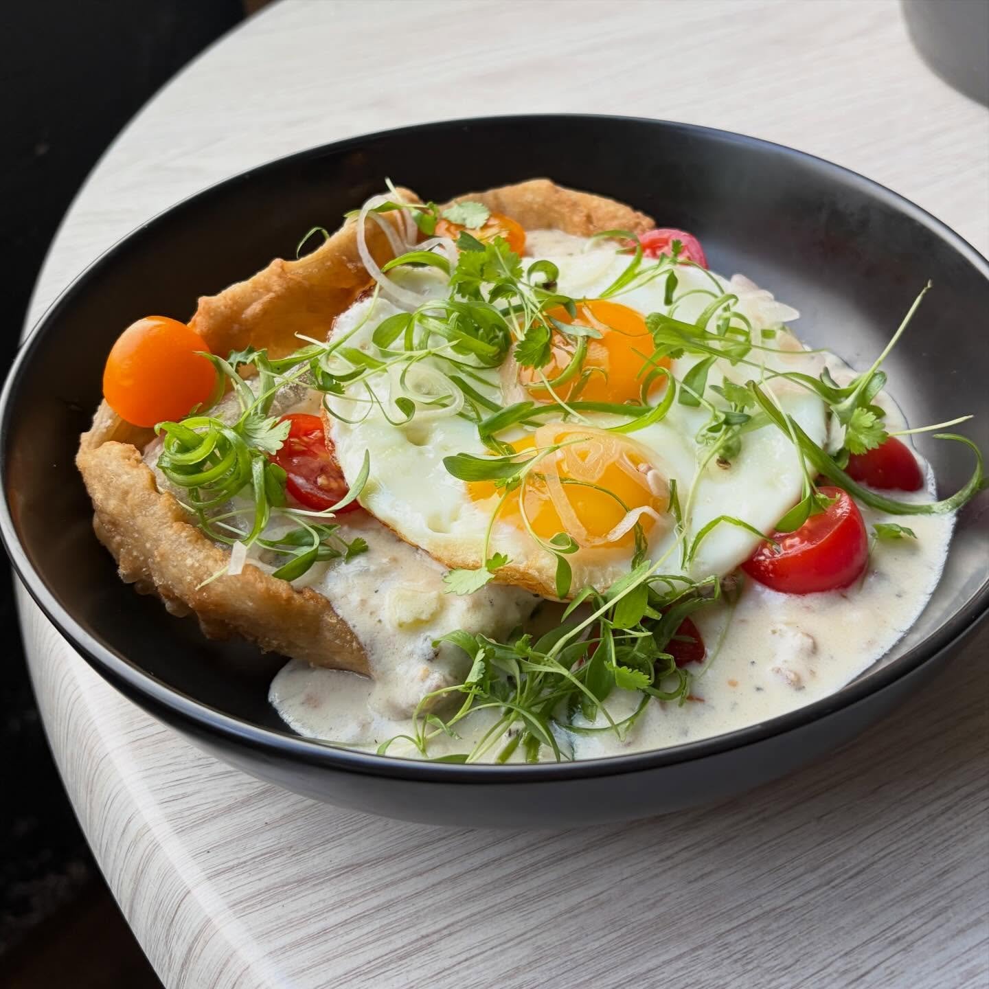 A couple of brunch items on our new menu. Fry bread and sausage gravy and in the second picture is our Eatery breakfast- 2 fried eggs, potato, pork belly, bacon veloute ,Comte and bacon onion jam. We will see you next Sunday.