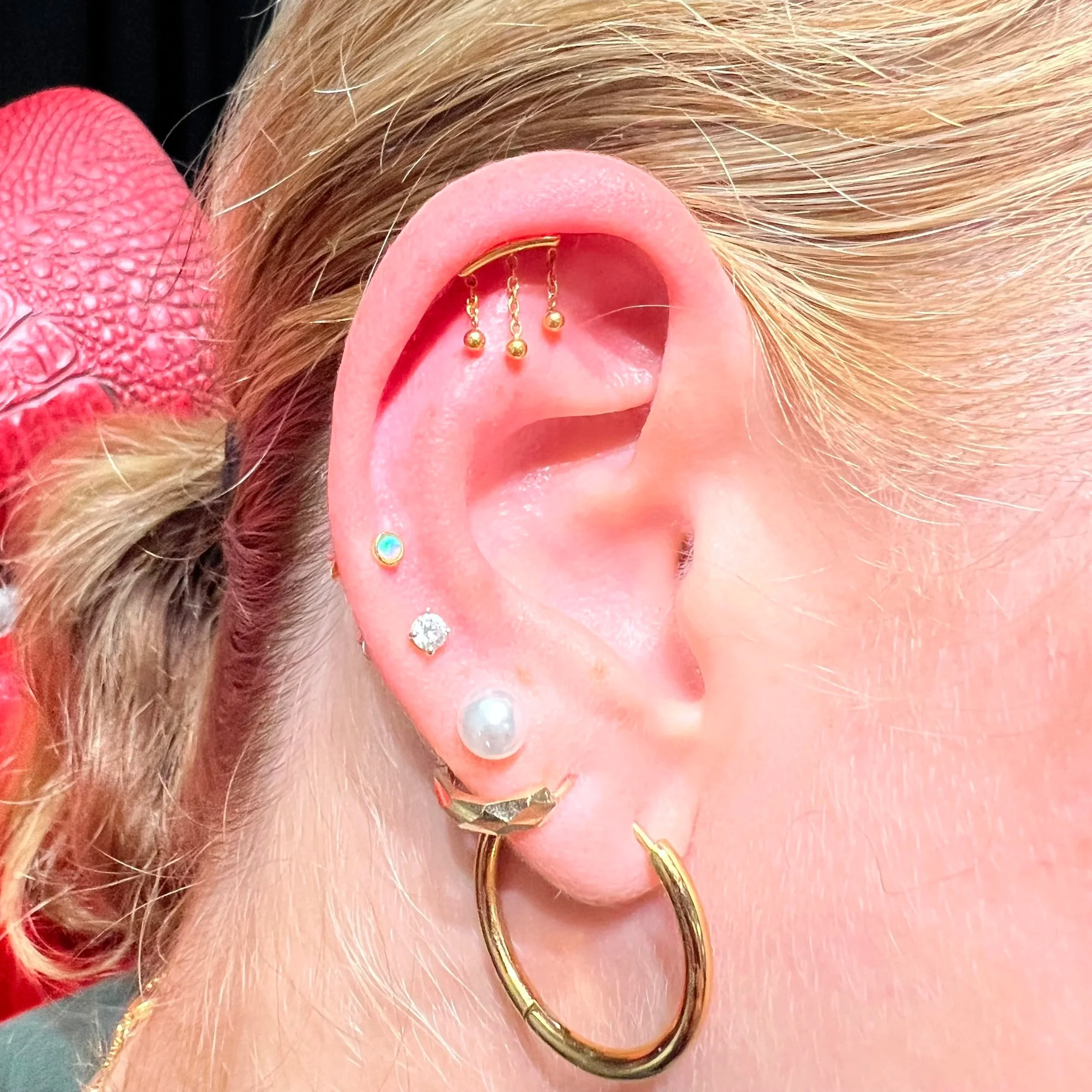 Professional ear piercing by Big Kahuna Tattoo in Boca Raton, Florida