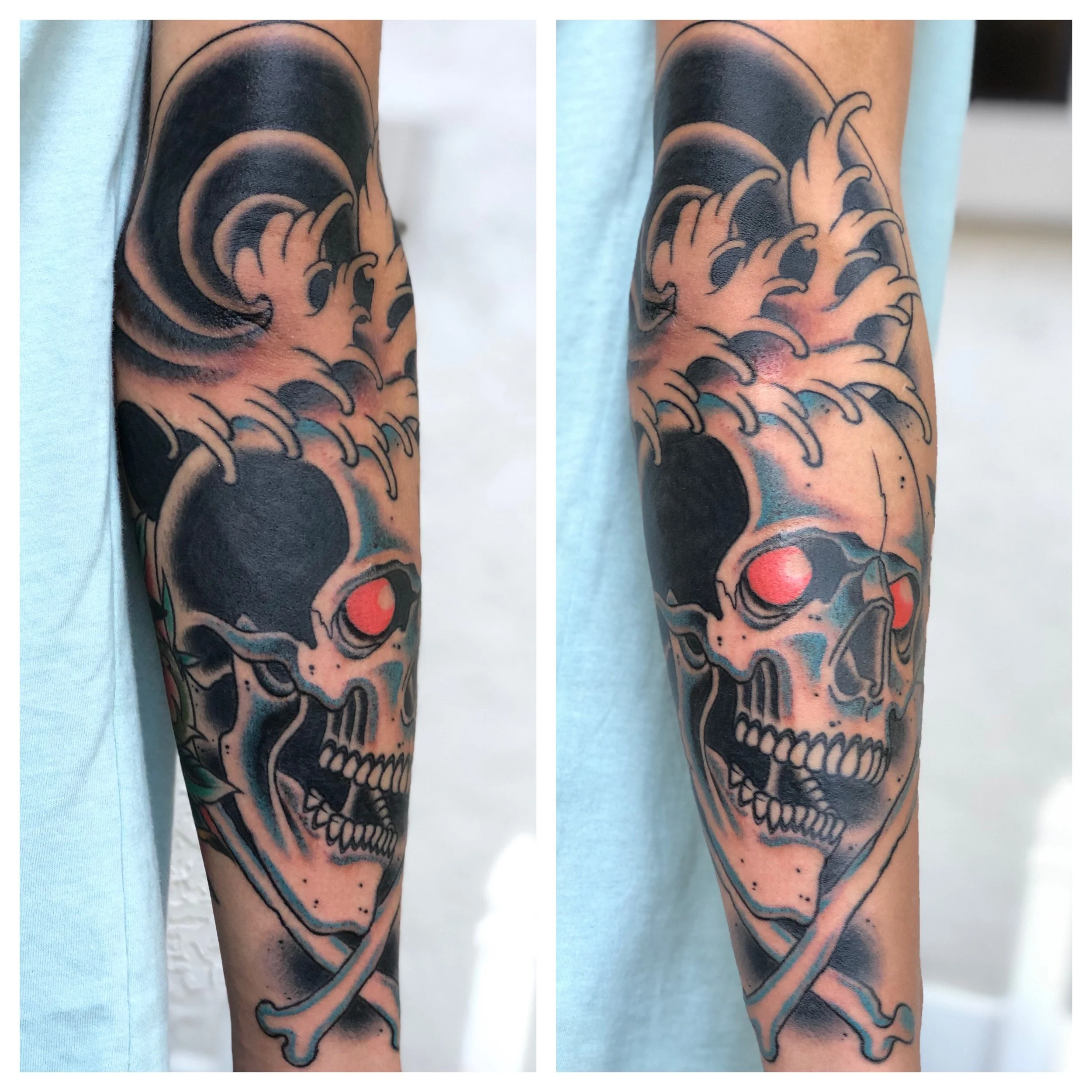 Traditional American color forearm tattoo featuring a bold skull and crossbones with red glowing eyes and dark finger waves, shown from two angles, custom tattoo by Nick at Big Kahuna Tattoo in Boca Raton, FL
