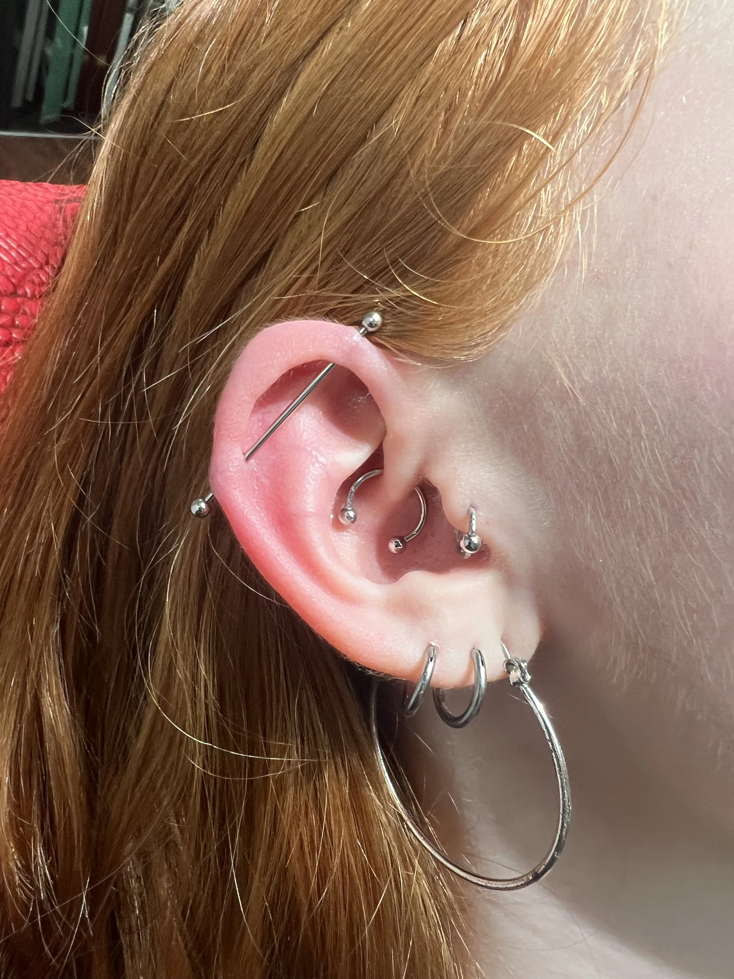Professional ear piercing by Big Kahuna Tattoo in Boca Raton, Florida