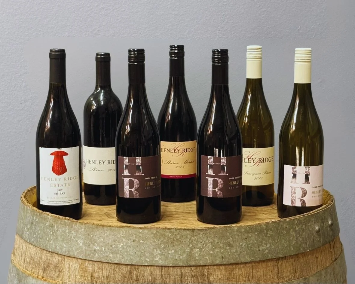 Wine bottle on a French Oak barrel at Henley Ridge Wines The Bellarine Geelong