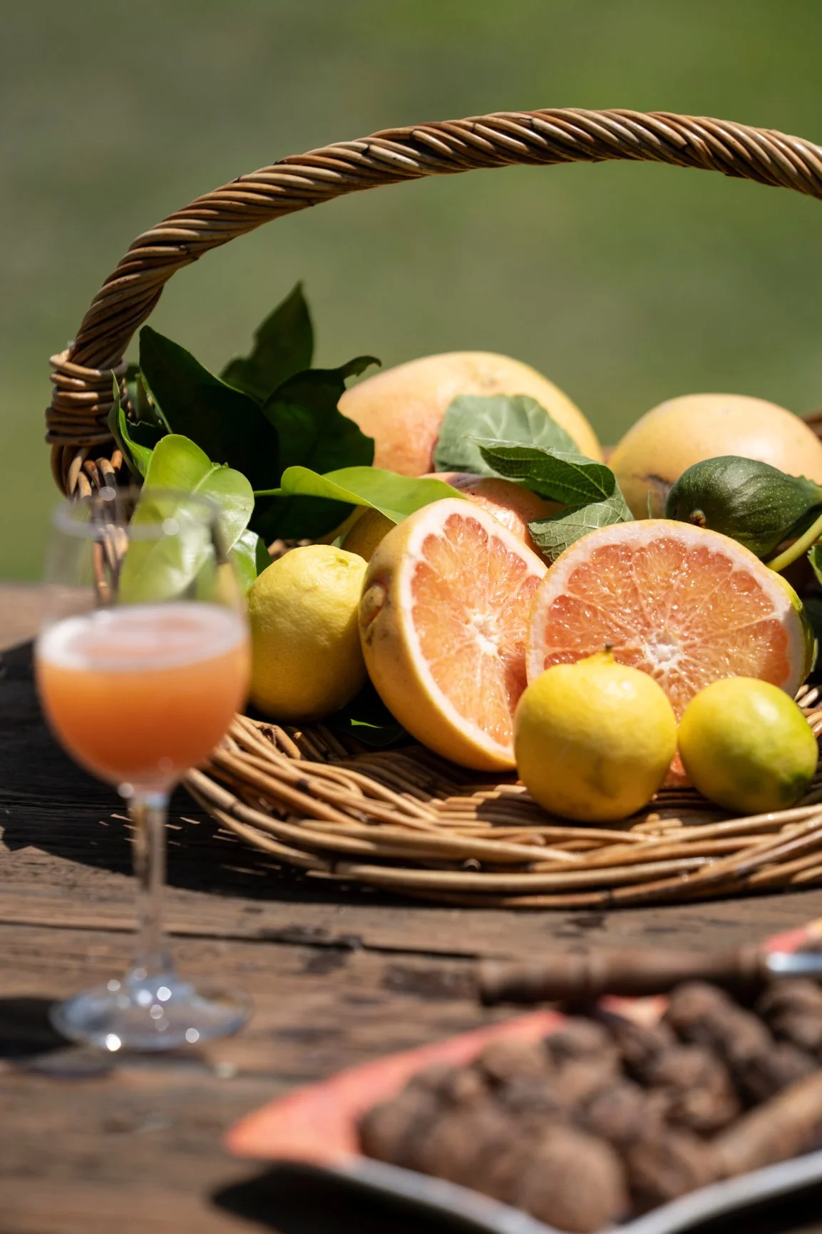 Grape Fruit in a basket with a wine glass of juice at Henley Ridge Wines The Bellarine Geelong