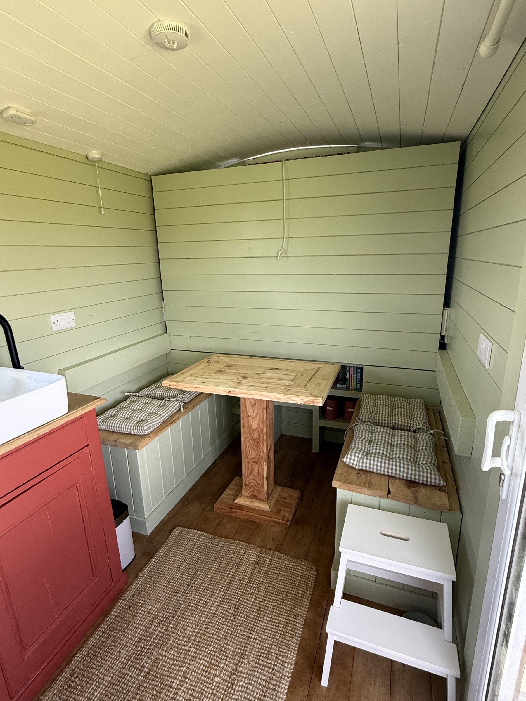 The bed folds away to reveal the dining space.