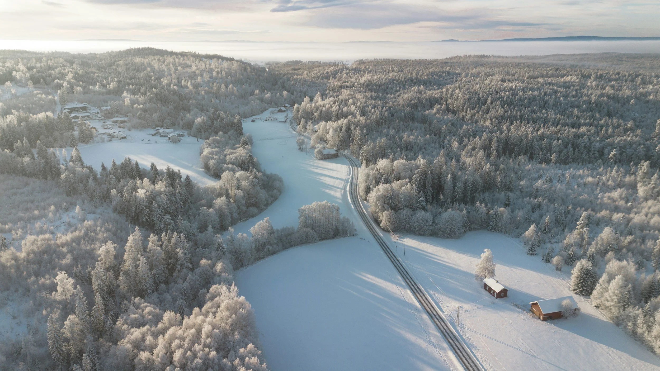 Snow-covered landscape in Norway showing how winter conditions affect travel.
