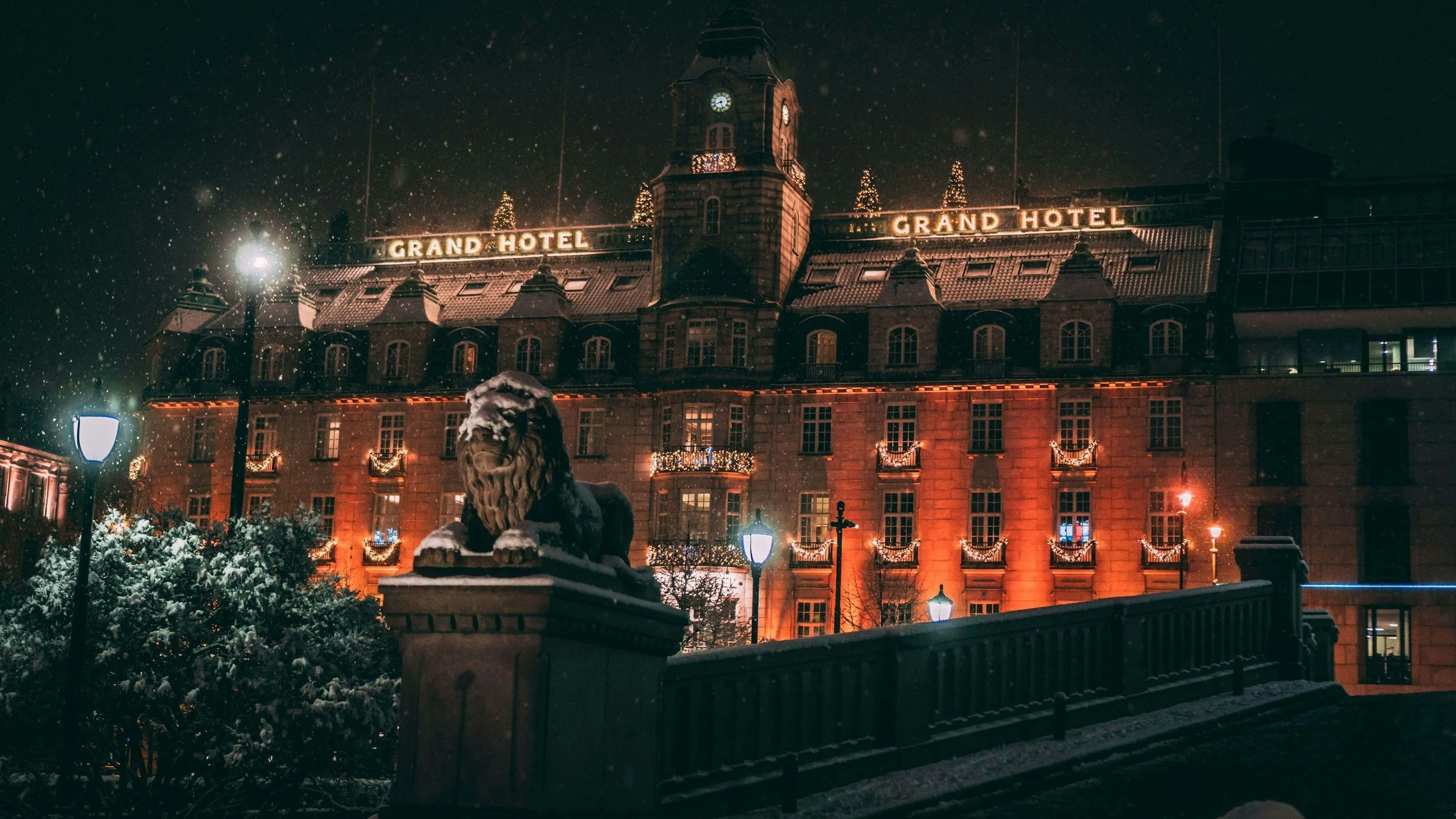 Grand Hotel Oslo exterior at night on Karl Johans gate, historic city hotel in Norway