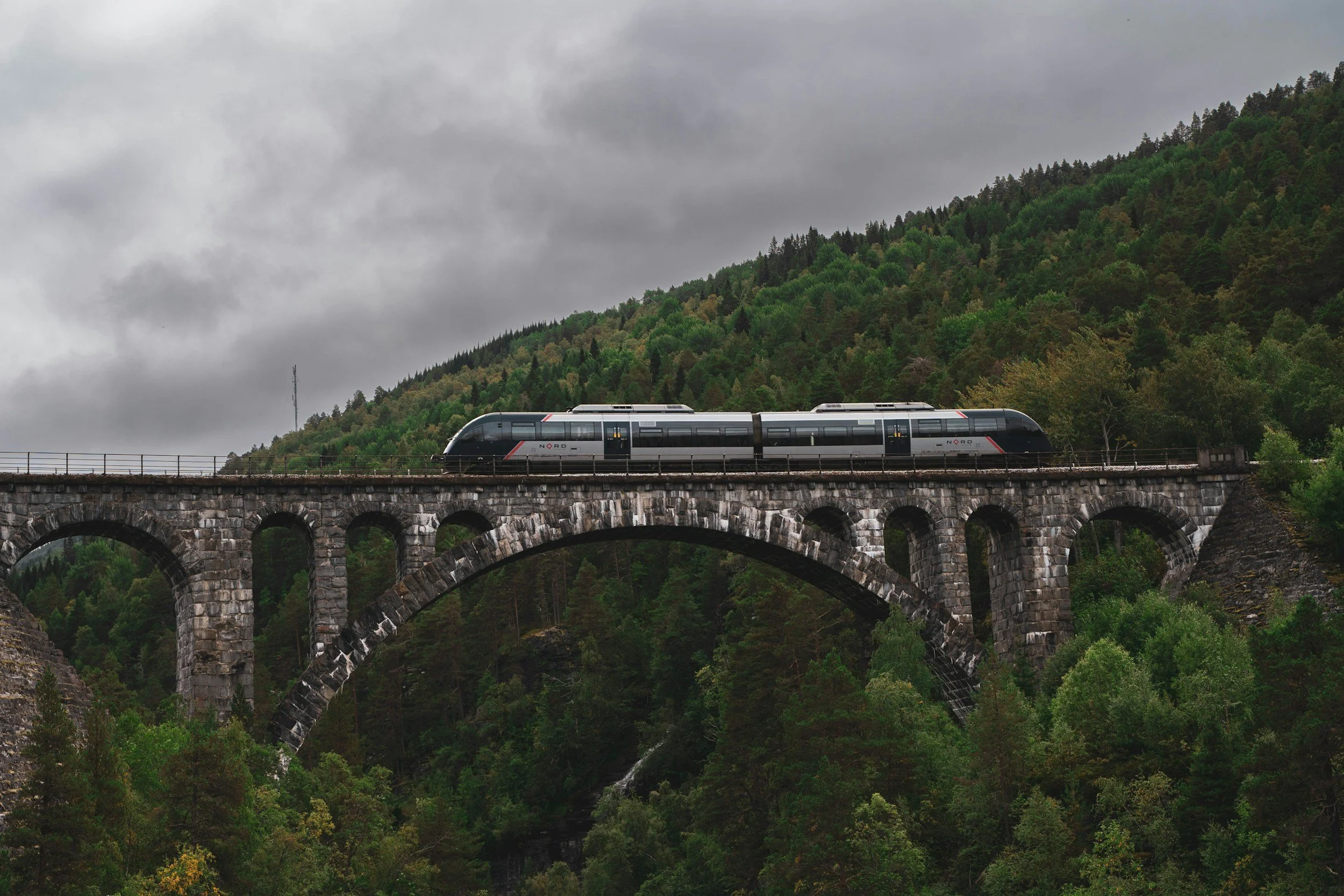 A train crossing a bridge in Norway.