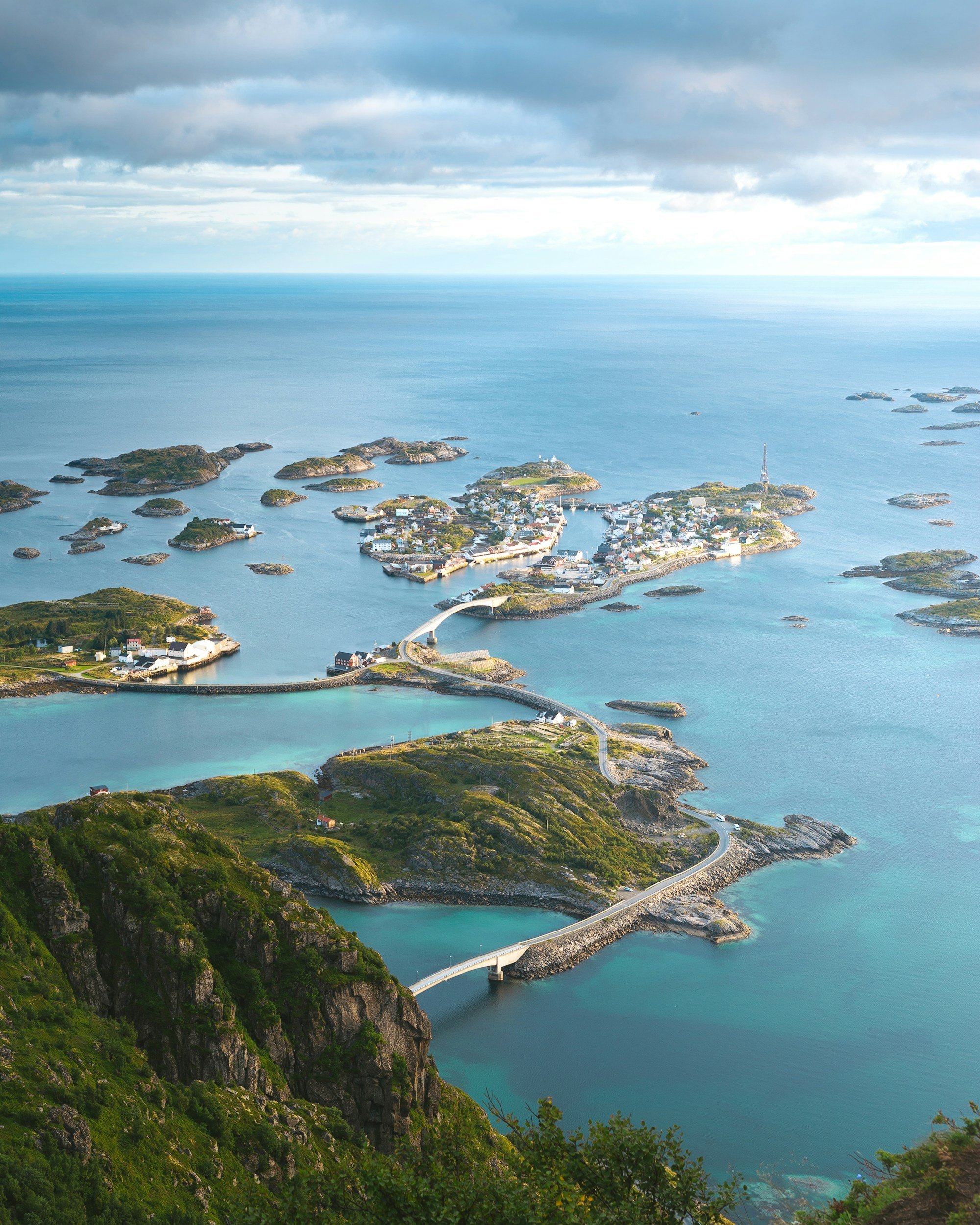 A picture of the road stretching between the islands of lofoten.