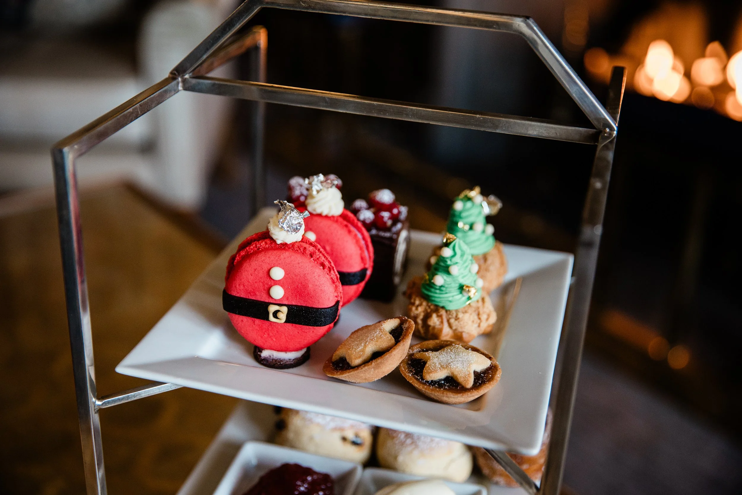 Festive Christmas pastries at Bovey Castle afternoon tea, including Santa macarons, choux buns and mince pies
