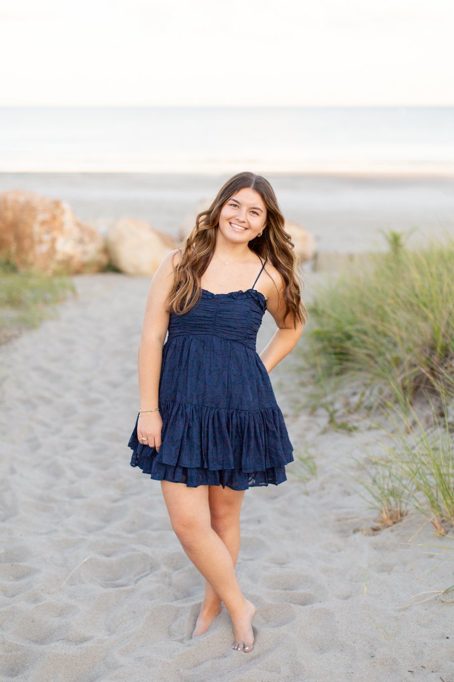 Beach photo session at Scarborough Beach featuring dunes and rocky shoreline