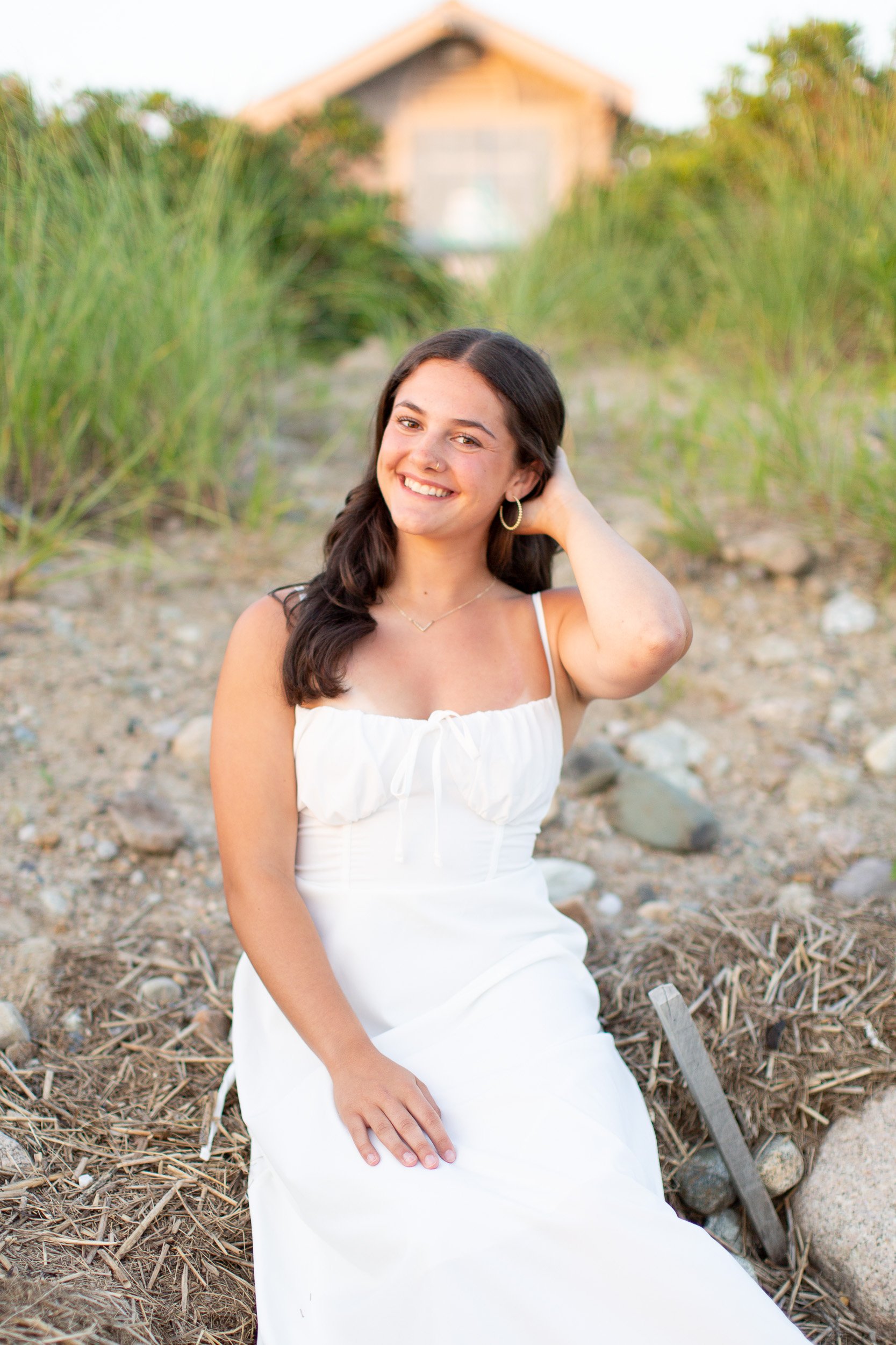 Natural senior portrait of an Oliver Ames High School senior smiling on Duxbury Beach.