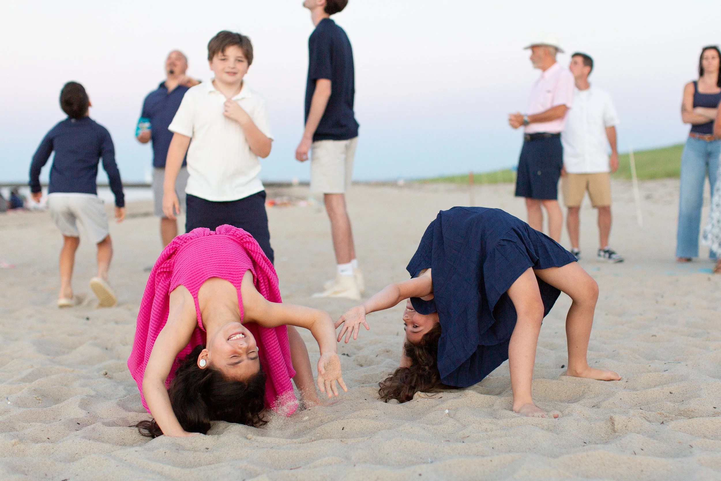 Kids playing together during an extended family beach session in Sandwich, Massachusetts.